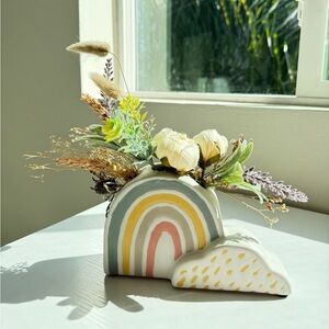 dried flowers in rainbow vase